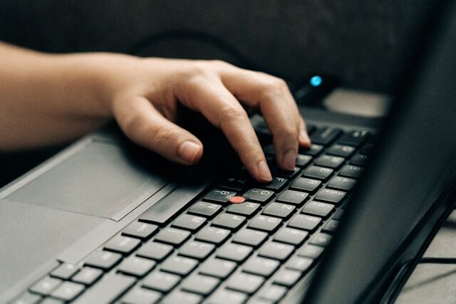 Hand typing on pc