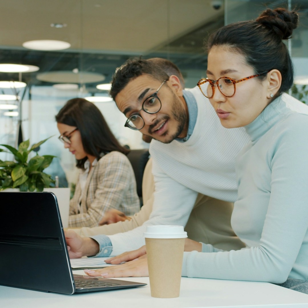 Three people in office working