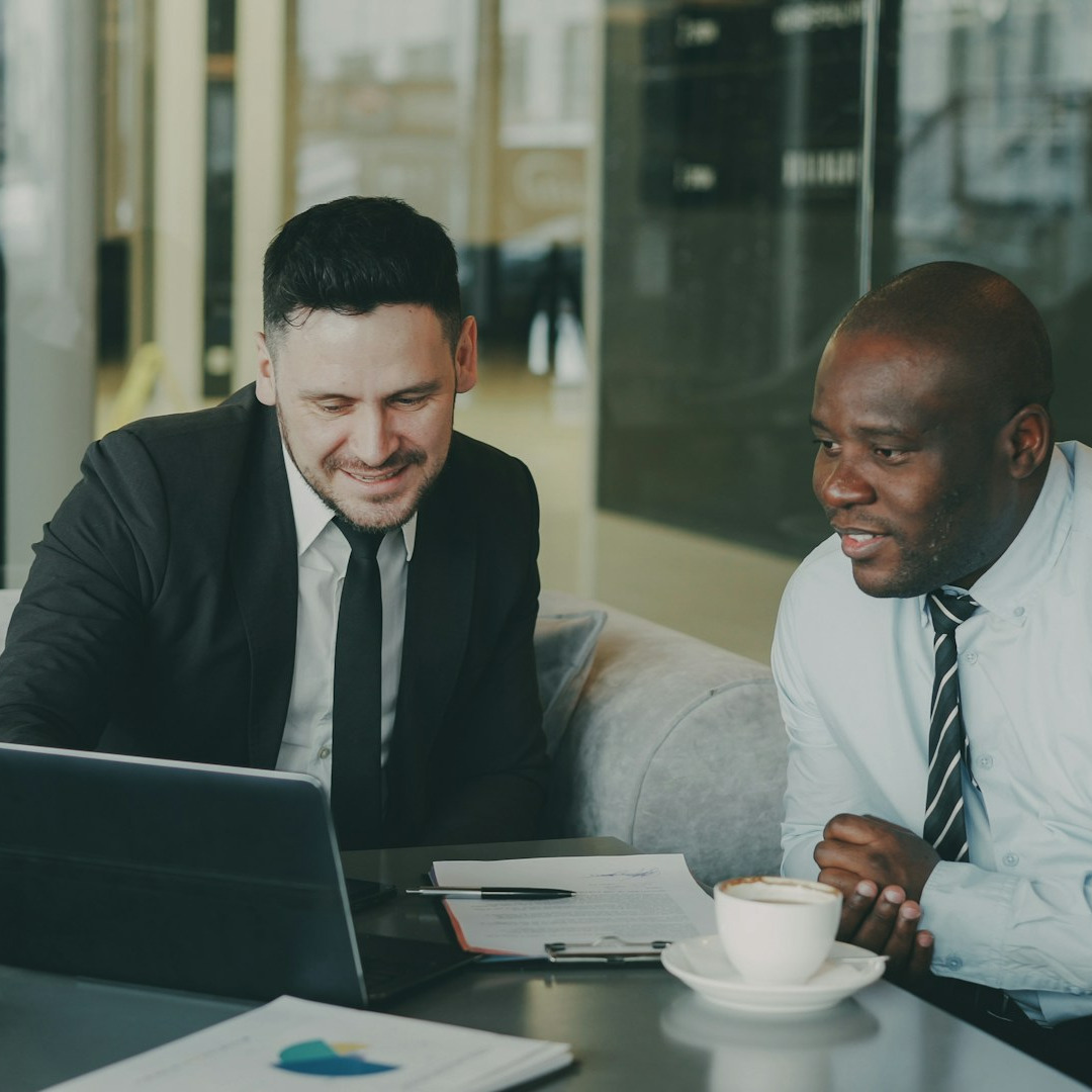 Two men working on computer